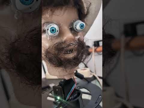 Creepy animatronic head with spare parts (and AI face detection)