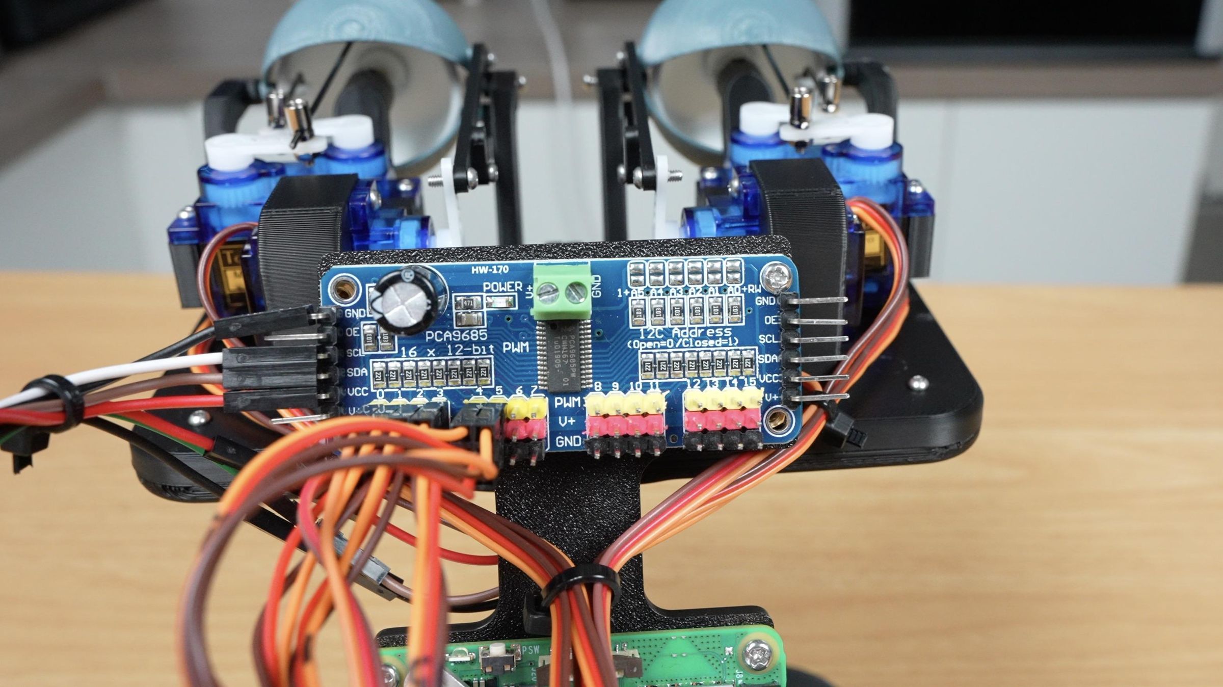 PCA9685 Servo Control Board With Servos Plugged In.jpeg