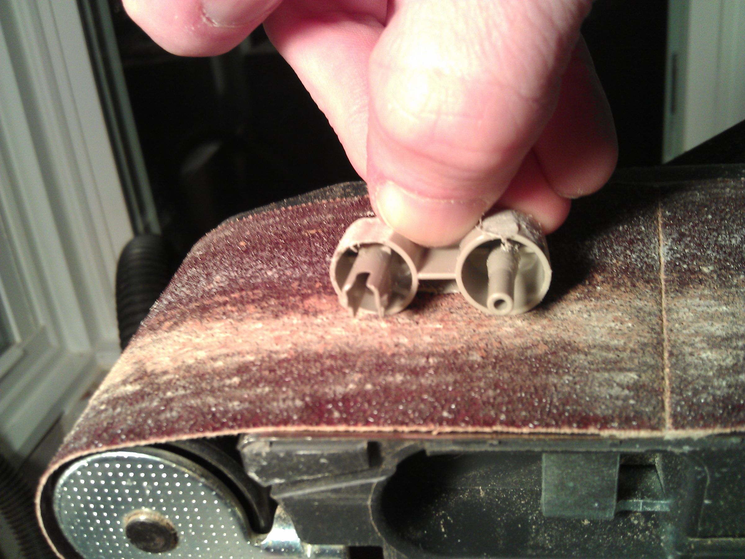 Sanding away most of plastic return key.jpg