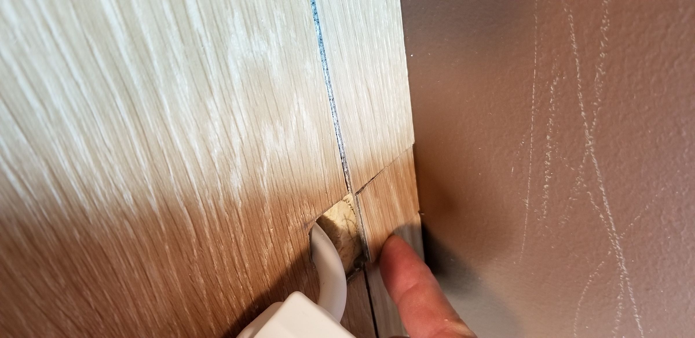 Studio finger pokes grommet in place.jpg