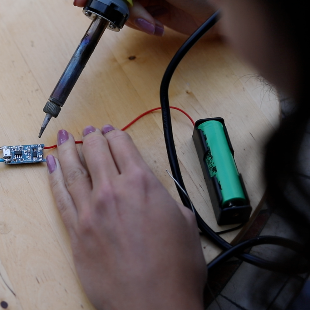 step_2_solder_battery_onto_charge_controller.png