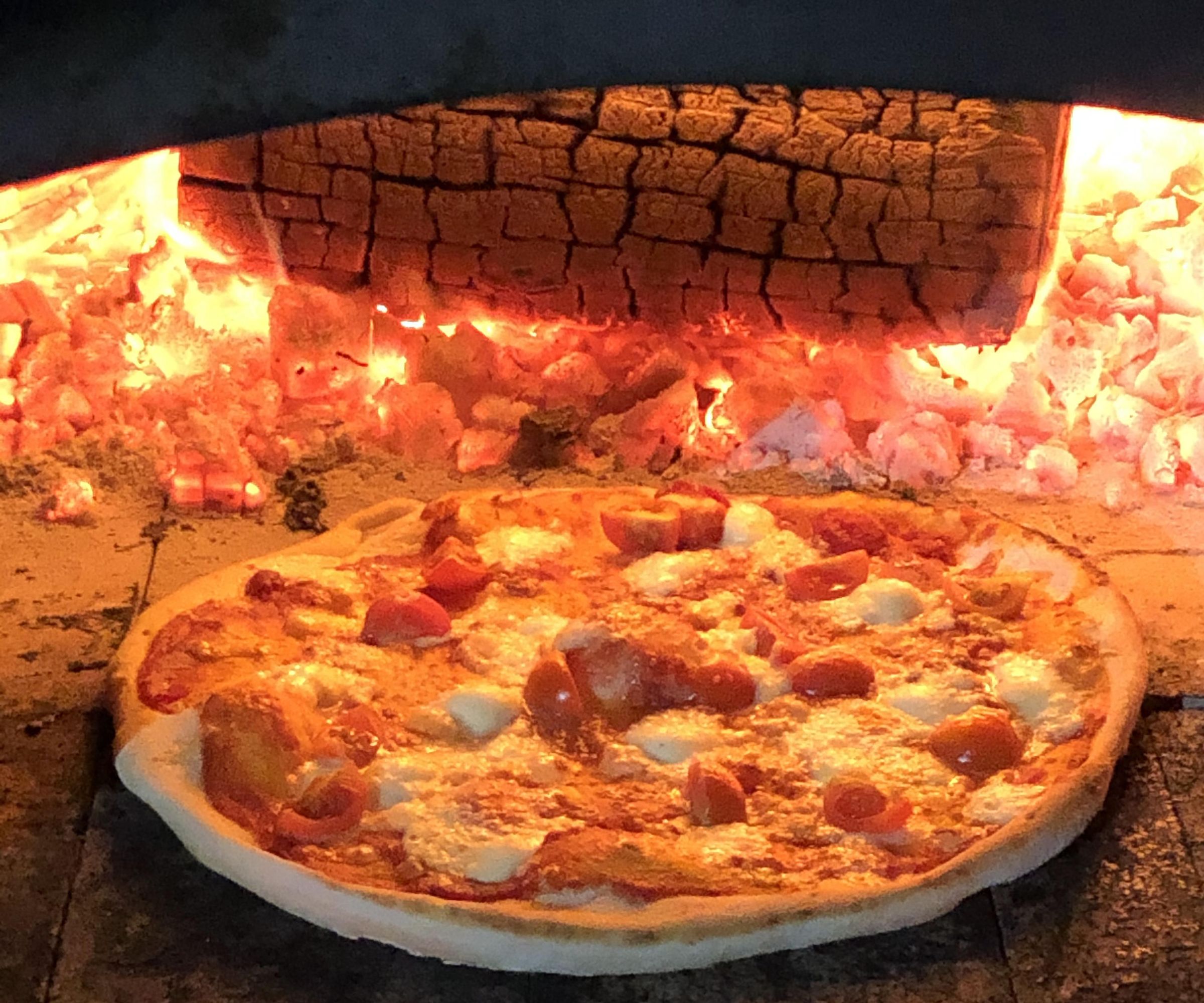 Cooking Pizza in a Wood Fired Oven 