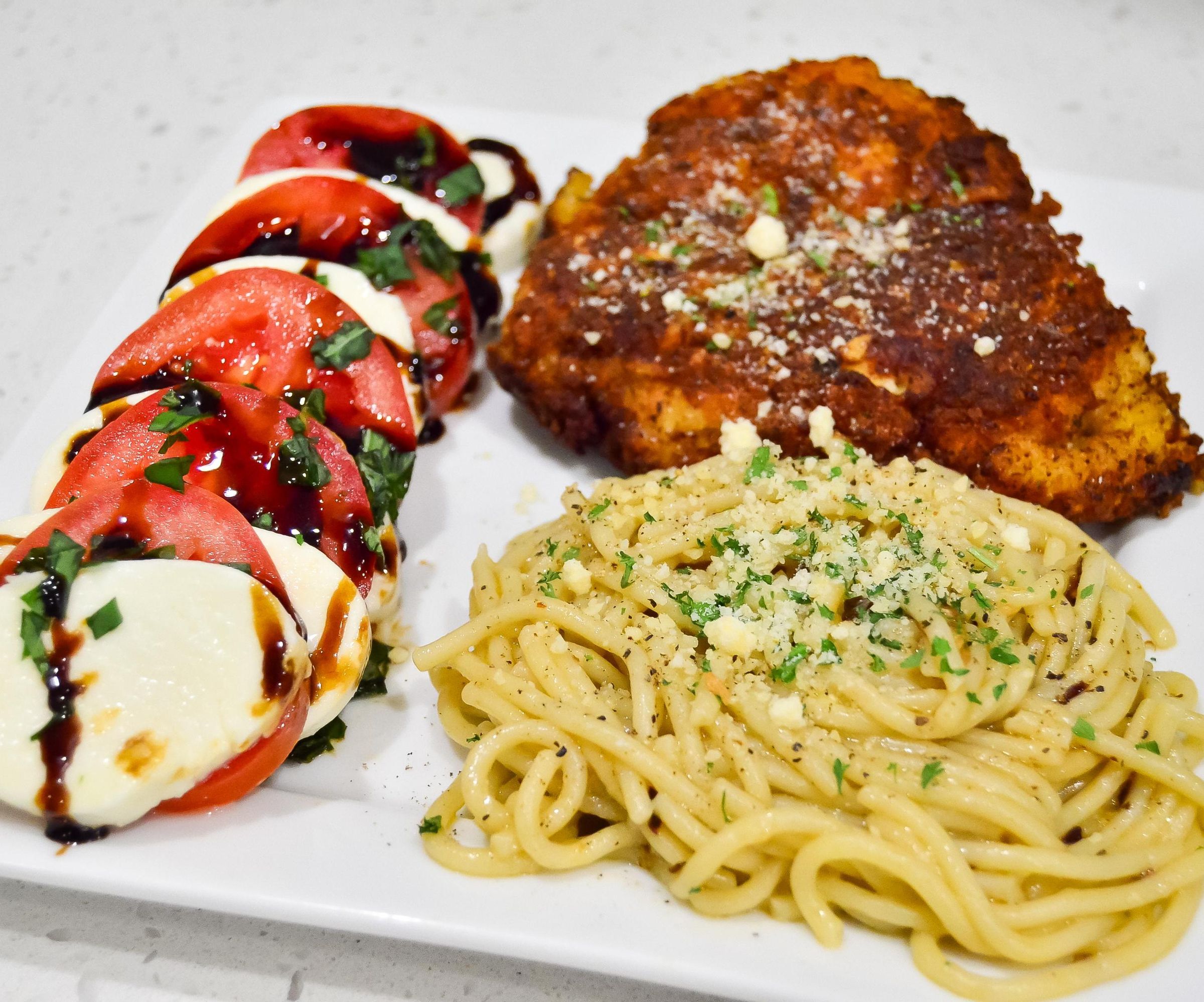 How to Make Chicken Milanese and Spaghetti Aglio E Olio With a Side of Caprese Salad