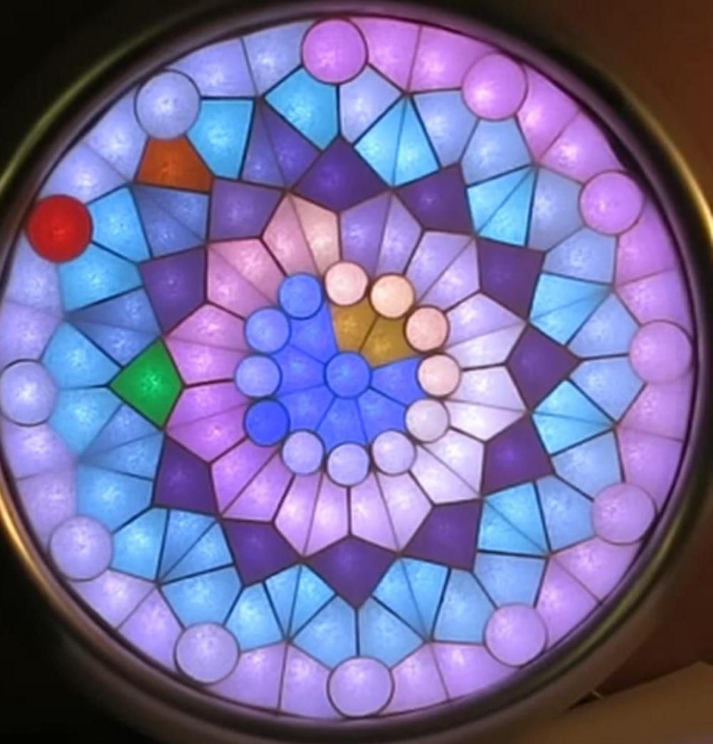 Fascination for Colours, a Somewhat Mysterious Clock in a Fake Stained Glass Window.