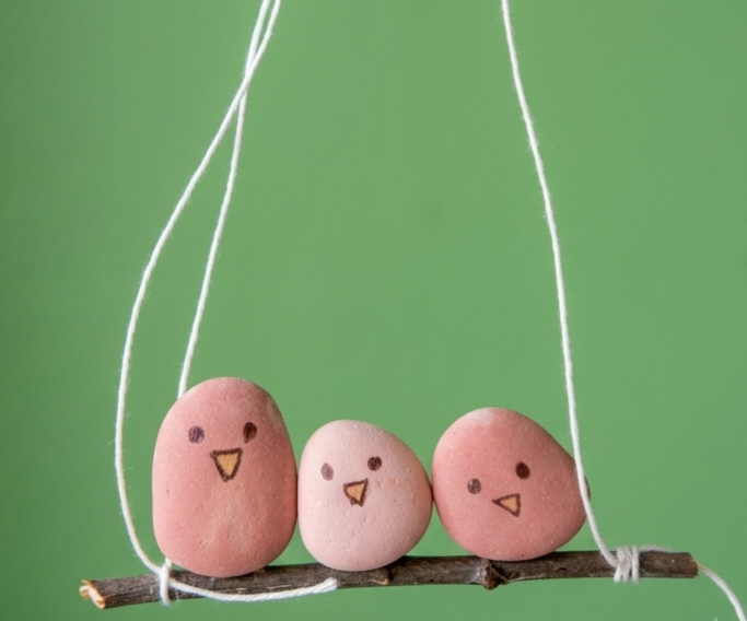 Minimalistic Sparrow Hanging Artifact With Pebbles