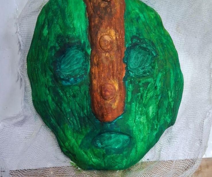 MASK MADE OF PAPER CLAY AND CLAY TILE