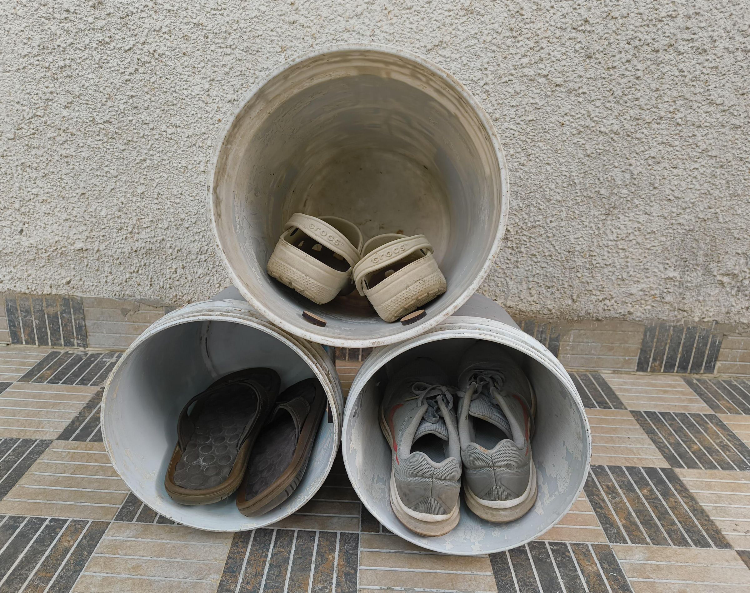 Repurposed Paint Buckets for Smart and Practical Shoe Storage.