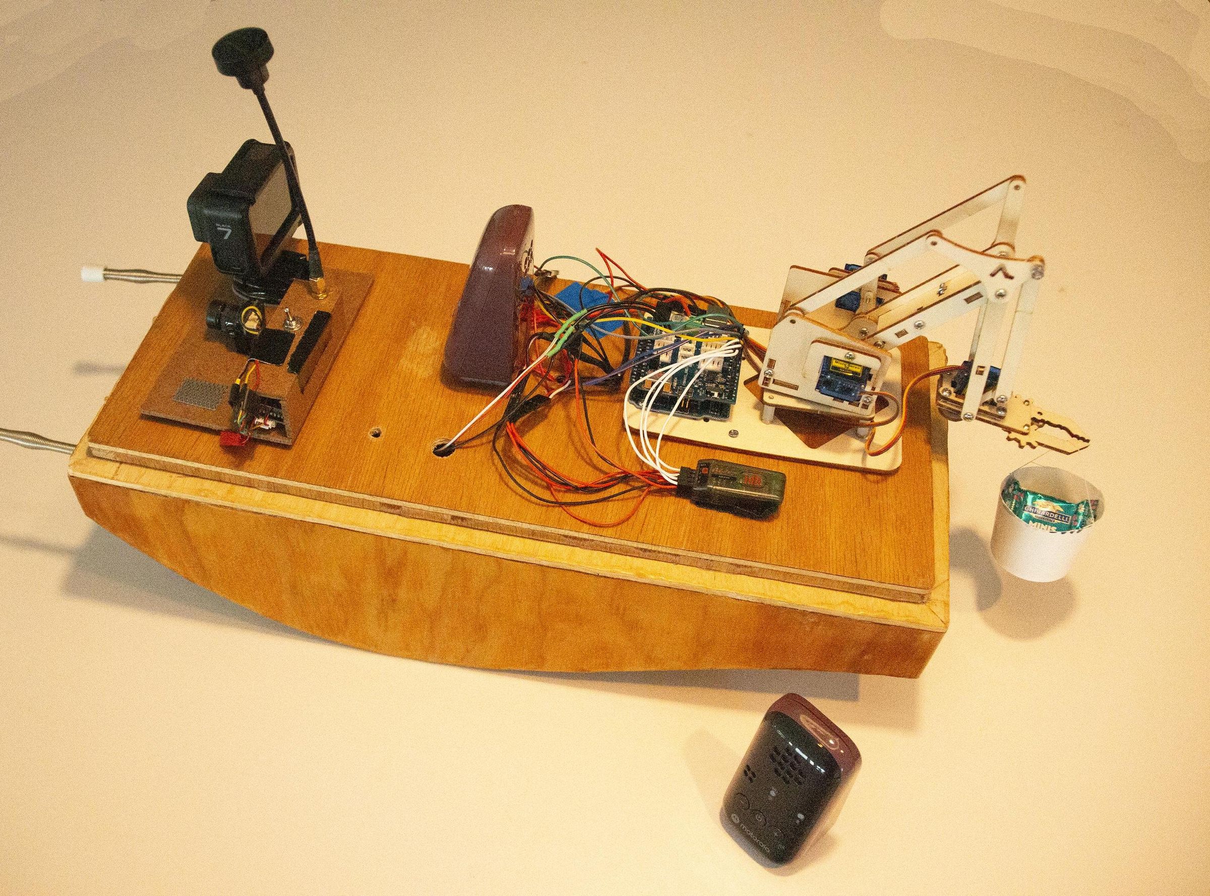 Robot Arm on Springer Tug Boat for Candy Delivery W/ 2 Cameras and Baby Monitor for Voice