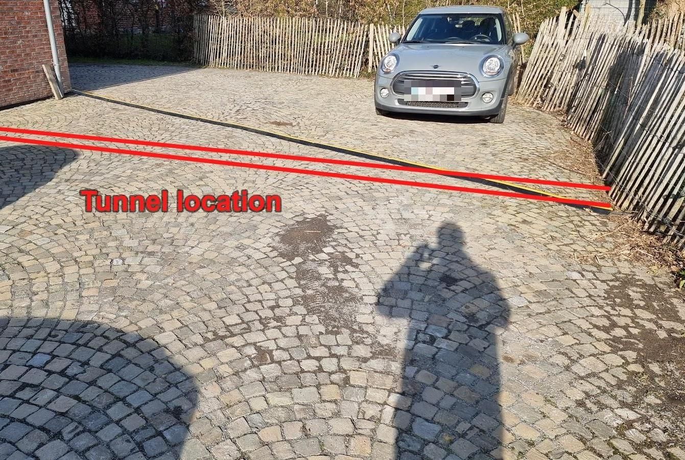 Hand-Dug 8-Metre Tunnel Under a Cobblestone Driveway