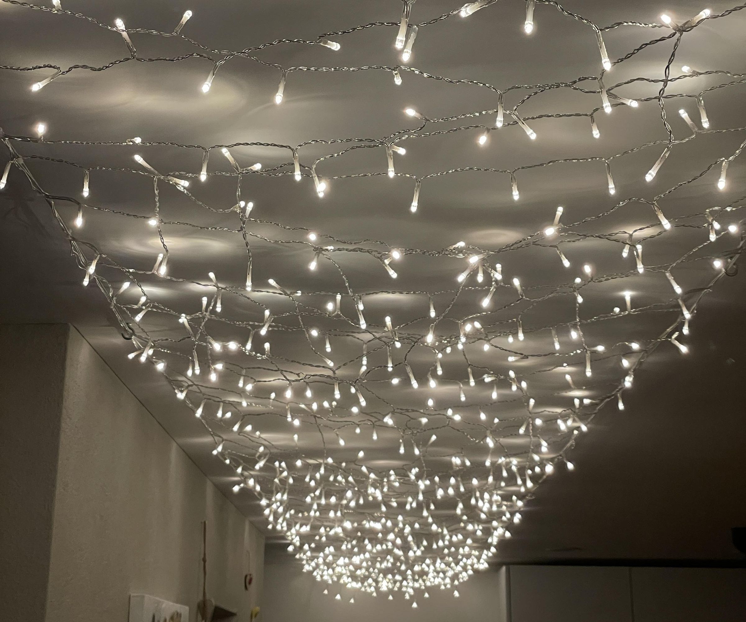 Create a Starry Sky Ceiling With Wire and String Lights